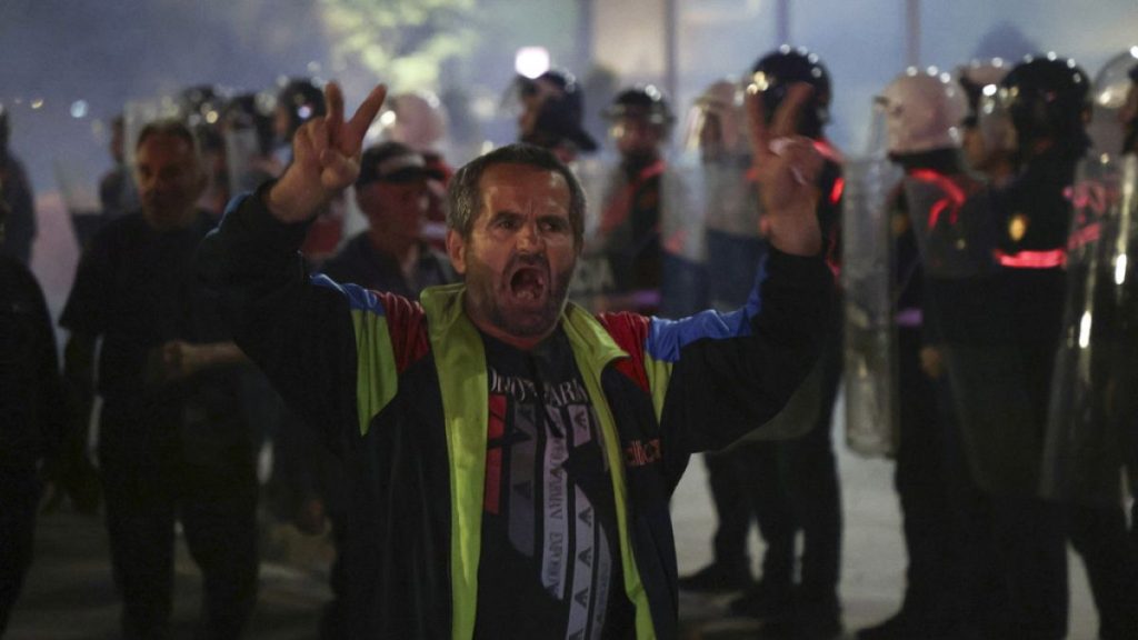 An opposition supporter protests during a rally, in Tirana, Albania, Monday, Oct. 7, 2024.