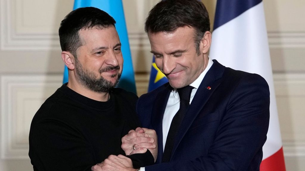 Ukrainian President Volodymyr Zelenskyy, left, and French President Emmanuel Macron shake hands after a press conference, on Feb. 16, 2024 at the Elysee Palace in Paris