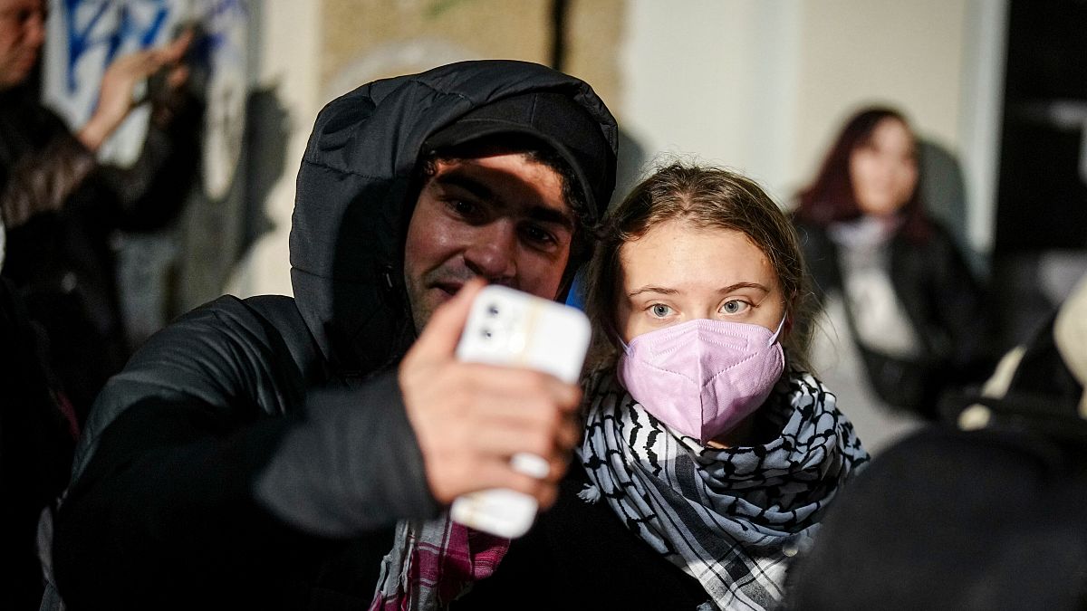 Swedish climate activist Greta Thunberg, right, attends a pro-Palestinian rally under the slogan