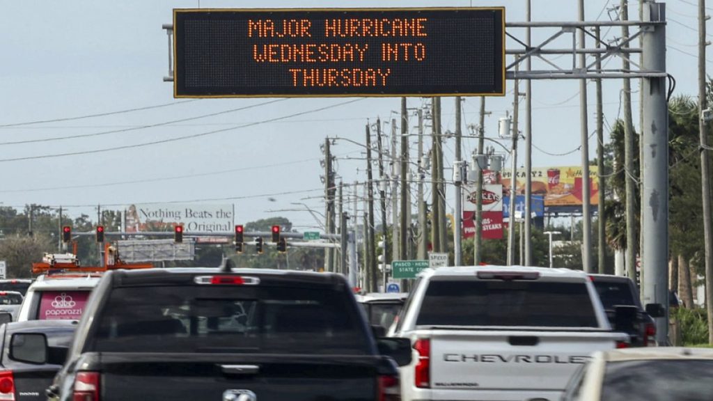 Highway signage announces the impending arrival of Hurricane Milton and the evacuations zones on Tuesday in Port Richey, Florida