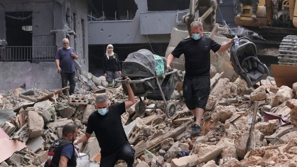 Residents of a building damaged in an Israeli airstrike in Beirut, Lebanon, on Saturday, 12 OCtober, 2024.