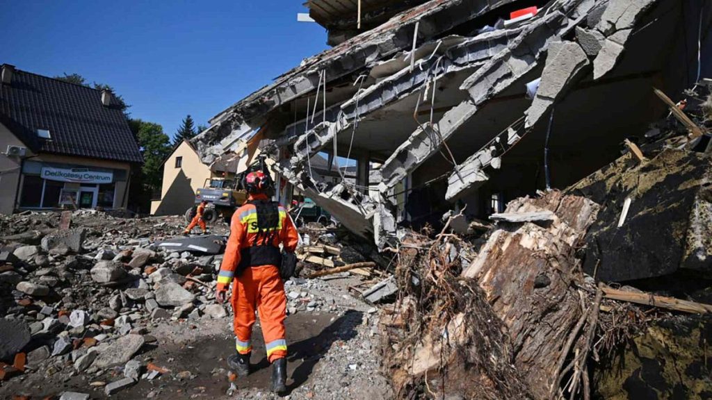 Firefighters inspect the safety of houses following heavy flooding in the town of Stronie Slaskie, southwestern Poland in September 2024