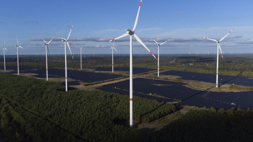 Wind turbines operate at the Klettwitz Nord solar energy park near Klettwitz, Germany on Tuesday