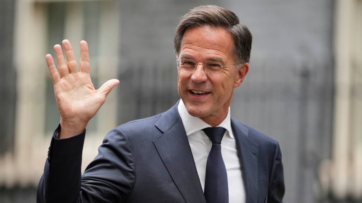 NATO Secretary General Mark Rutte waves to the media after a meeting with Keir Starmer and Volodymyr Zelenskyy in London, Thursday, Oct. 10, 2024.