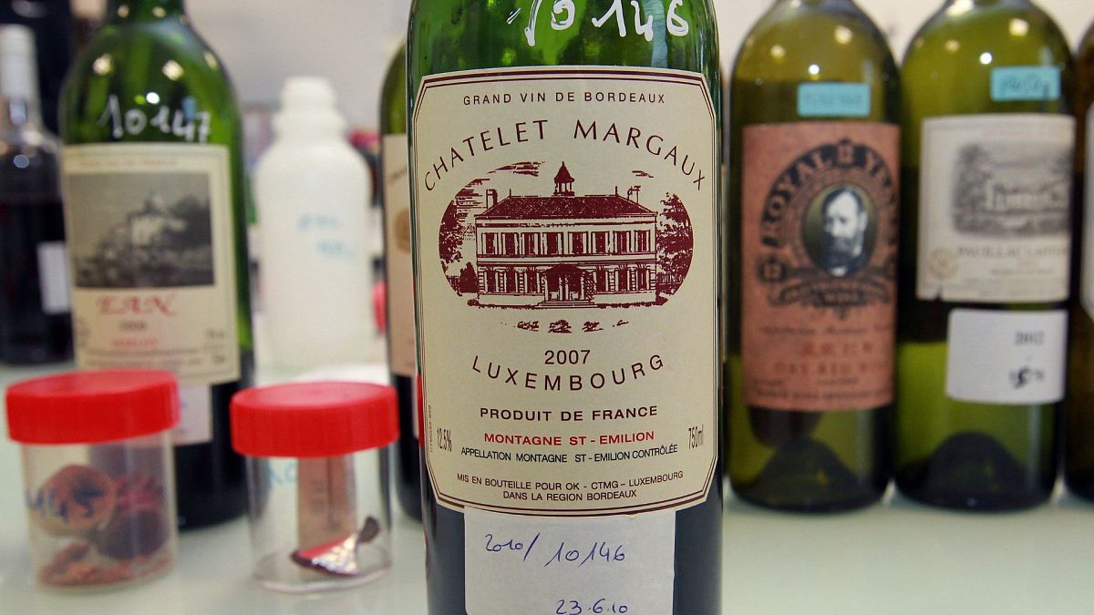 In this photo dated Tuesday, Nov. 12, 2013, example of a counterfeit bottle of wine is displayed in a lab run by the French Finance ministry in Bordeaux, southwestern France.