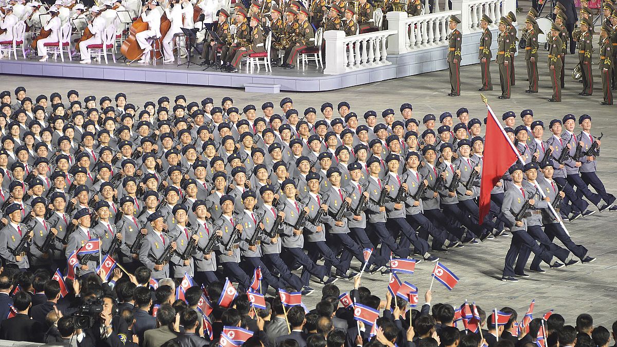 North Korean troops parade during a celebration of the nation