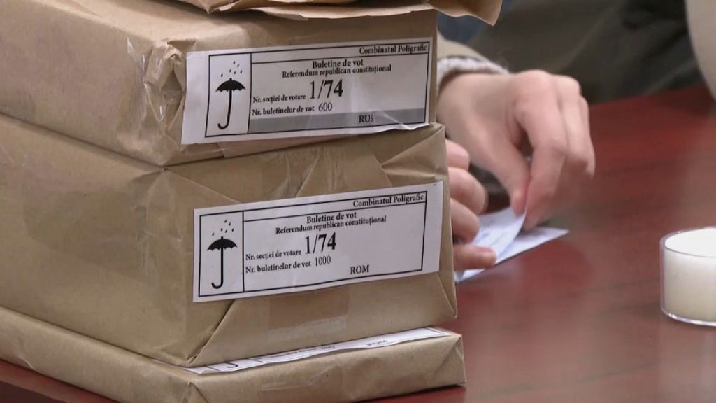 Workers prepare ballot papers at a polling station in Chișinău, 19 October, 2024