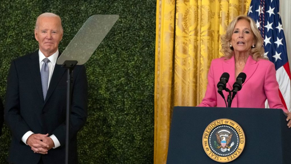 First lady Jill Biden speaks alongside President Joe Biden during a National Arts and Humanities Reception in the East Room at the White House in Washington