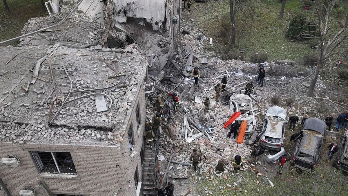 In this photo provided by the Ukrainian Emergency Service, emergency workers clear the rubble after an overnight Russian attack with guided bombs in Zaporizhzhia, Ukraine.