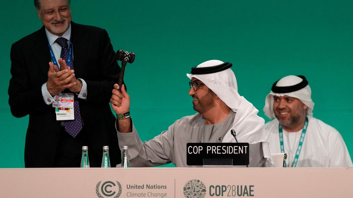 COP28 President Sultan al-Jaber bangs the final gave of the COP28 UN Climate Summit, 13 December 2023, in Dubai, United Arab Emirates.