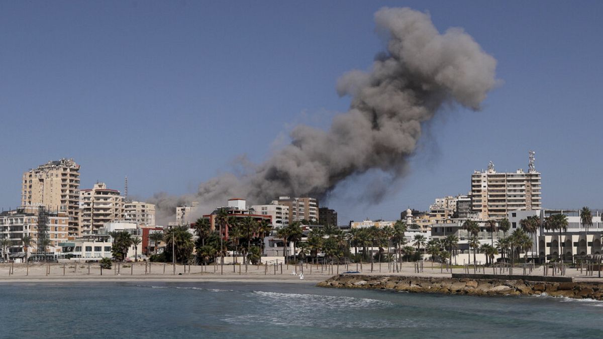 Smoke rises from buildings hit in an Israeli airstrike in Tyre, Lebanon, Wednesday