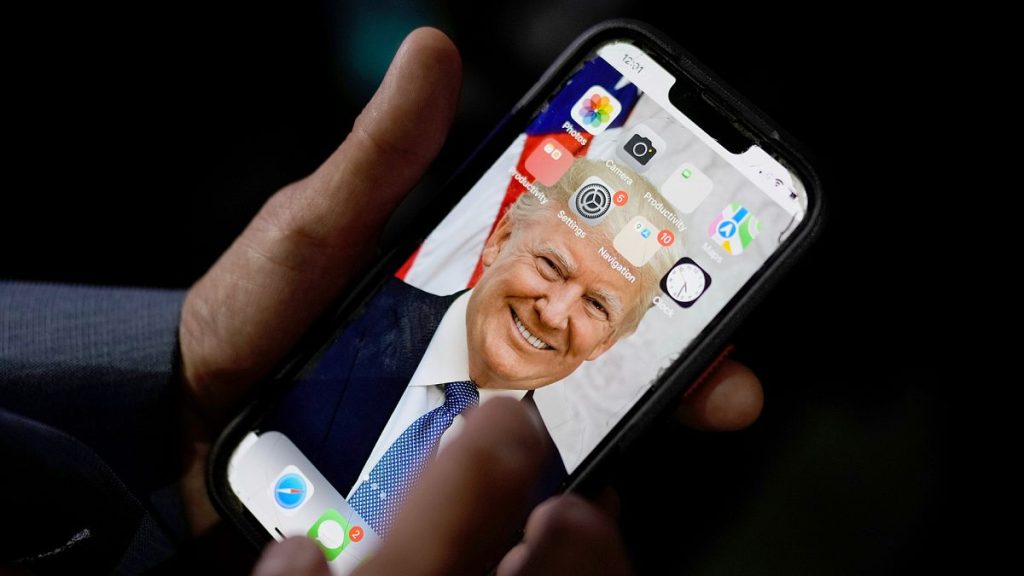 FILE: A phone with an image of Republican presidential candidate Donald Trump, at the Republican National Convention, in Milwaukee, 17 July 2024