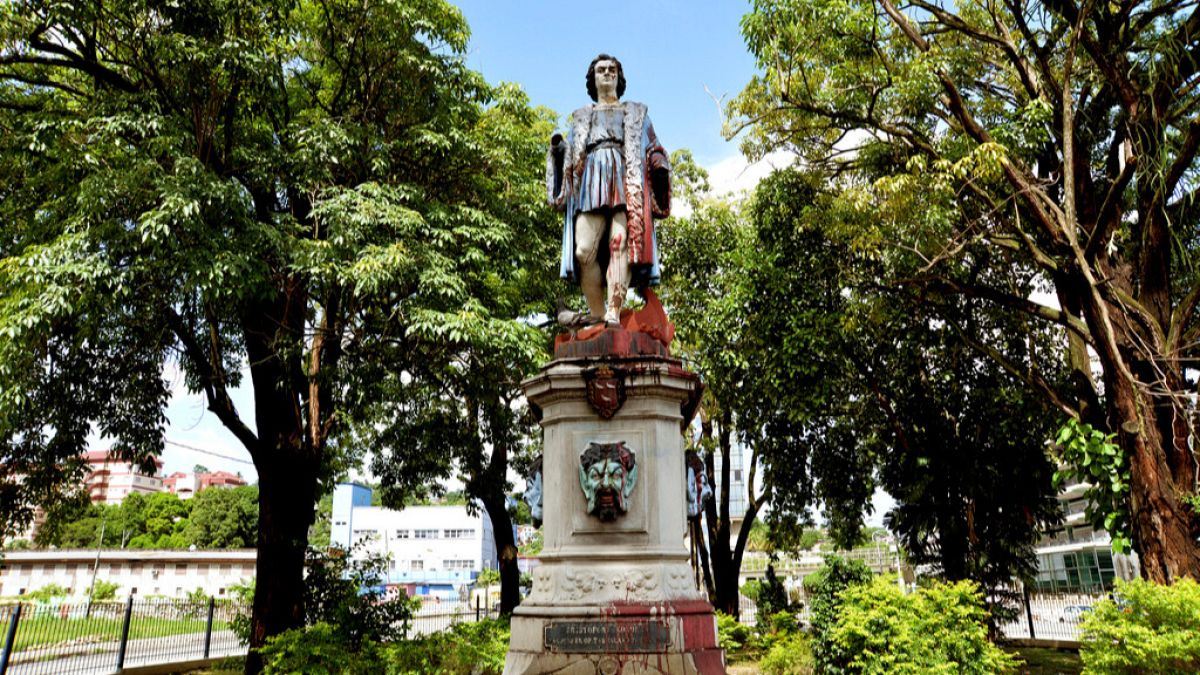 FILE - A vandalised statue of Christopher Columbus towers over Columbus Square in Port of Spain, Trinidad and Tobago, on Wednesday, 28 August, 2024.