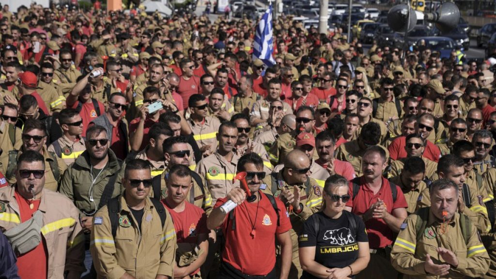 Hundreds of seasonal firefighters attend a protest outside Greece