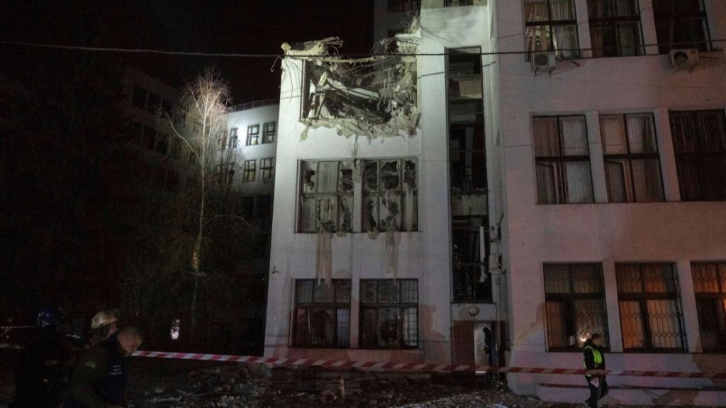 Firefighters inspect the damaged office building after it was hit by Russian aerial guided bombs in central Kharkiv, Ukraine, Monday, Oct. 28, 2024.