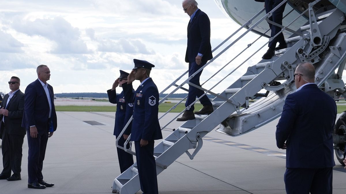 President Joe Biden walks down the steps of Air Force One at Raleigh-Durham International Airport in Morrisville, N.C., Wednesday, Oct. 2, 2024.