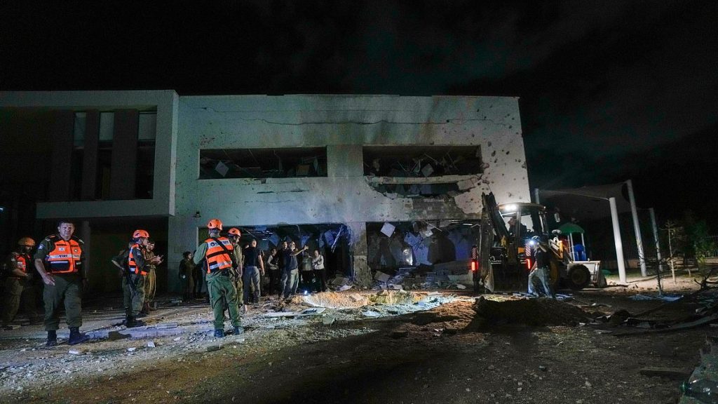 Israeli military and police work at a damaged school building that was hit by missiles fired from Iran in Gadera, Israel.