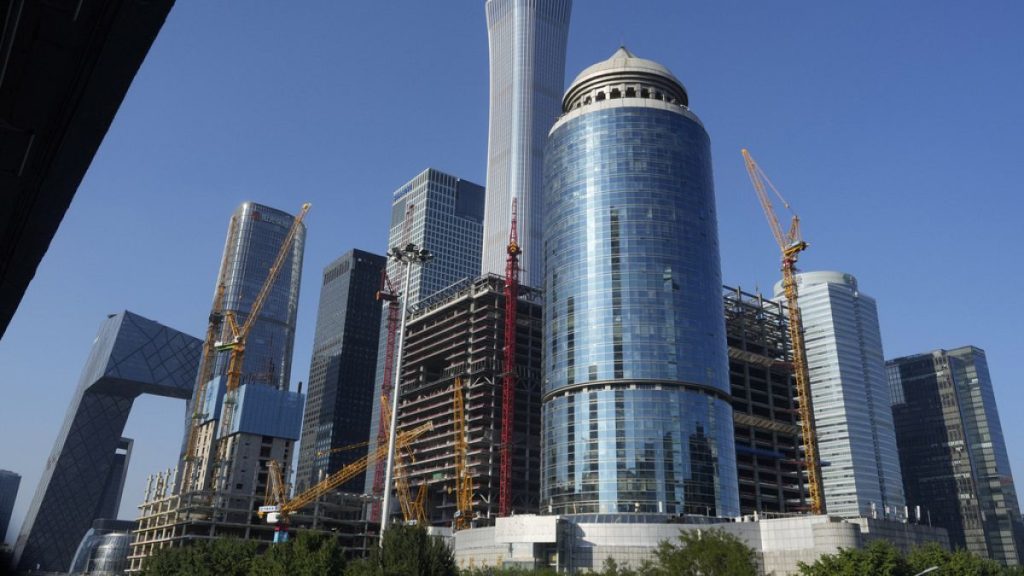 Construction cranes are seen near the central business district in Beijing, Aug. 8, 2024