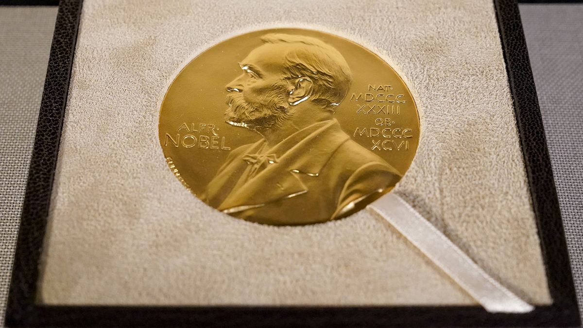 The Nobel Prize medal displayed.