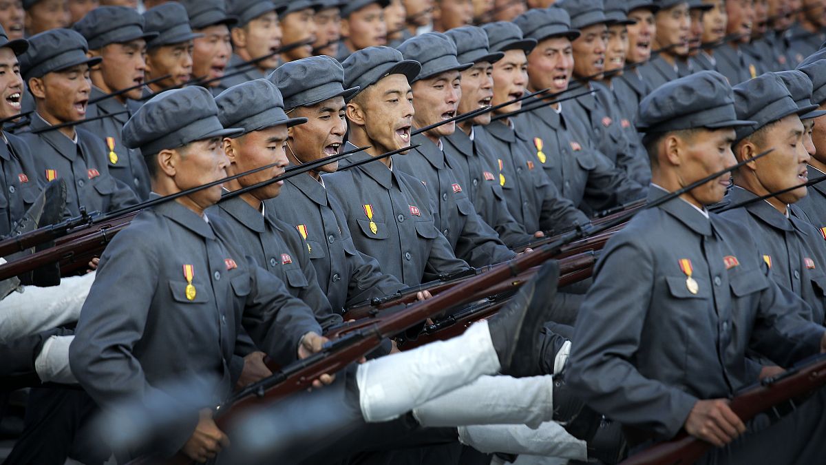 North Korean soldiers in historic uniforms march during a parade on the Kim Il Sung Square, Saturday, Oct. 10, 2015, in Pyongyang, North Korea.