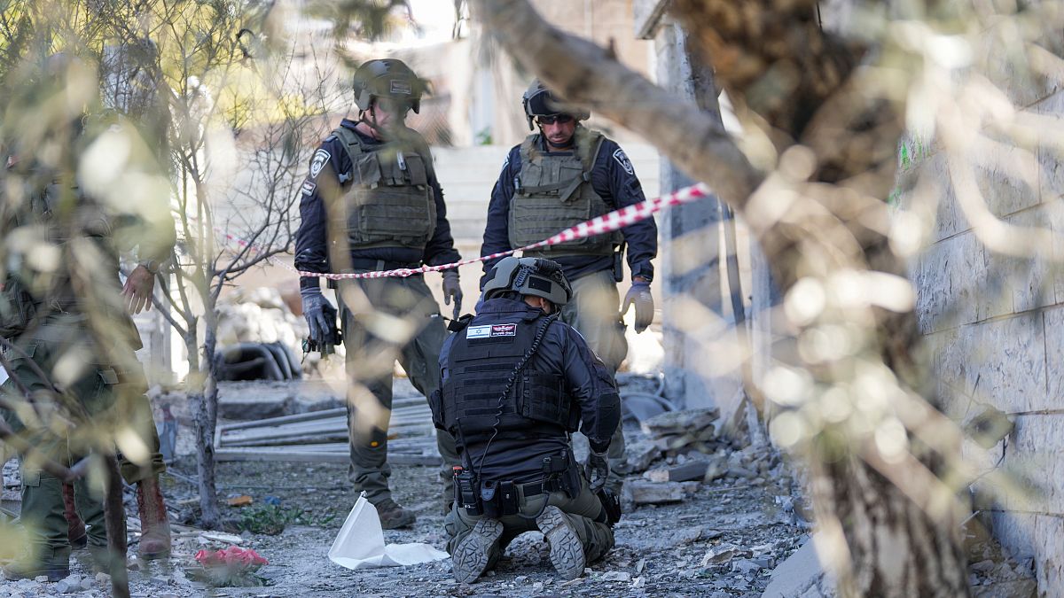 FILE PHOTO - Members of the Israeli police bomb squad work at the site where one person was killed after a projectile launched from Lebanon Oct. 29, 2024.