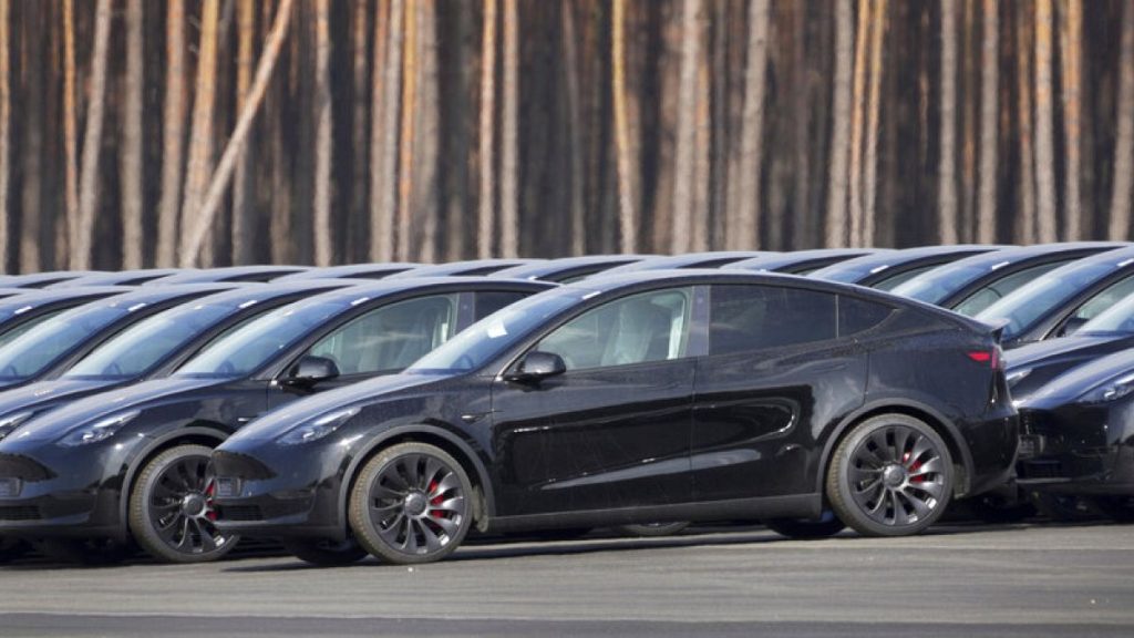 Tesla cars are parked at the construction site of the new Tesla Gigafactory for electric cars in Gruenheide near Berlin, Germany, Friday, March 18, 2022.