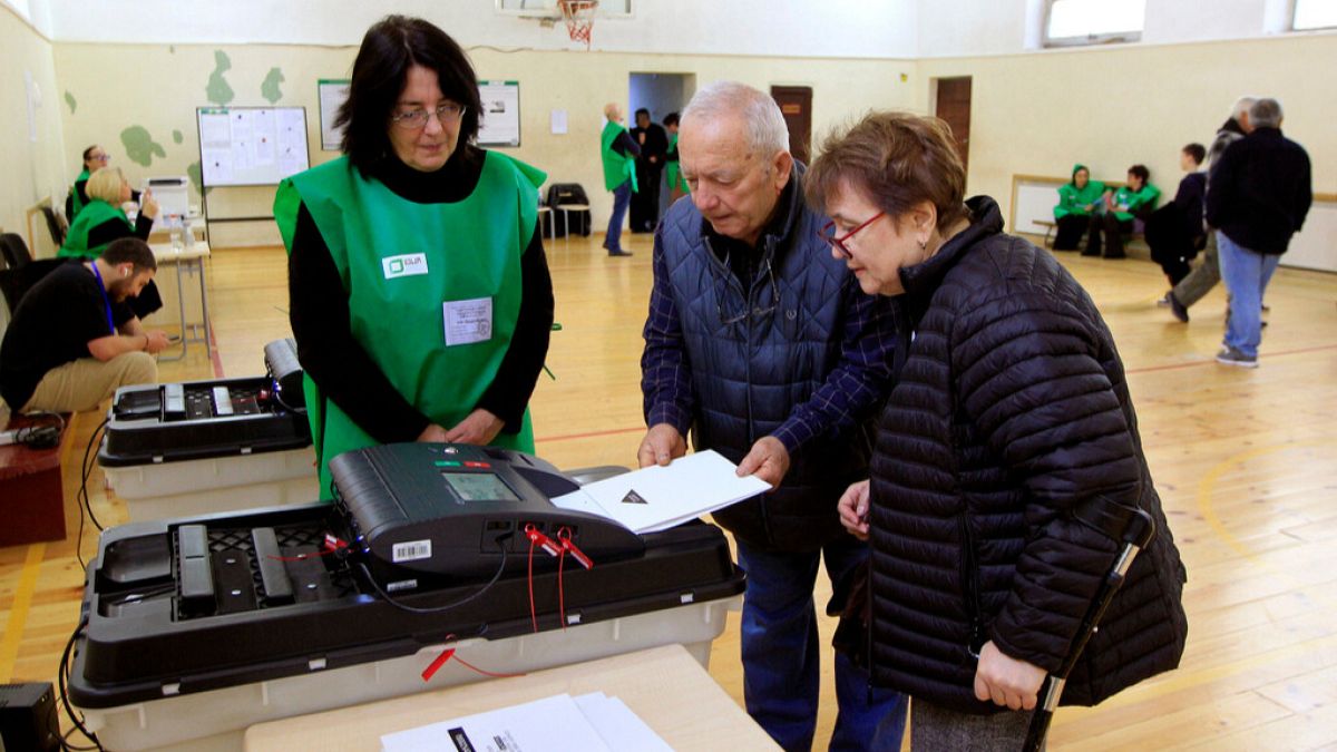 People cast their ballots at a polling station during the parliamentary election in Tbilisi, Georgia, Saturday, Oct. 26, 2024.