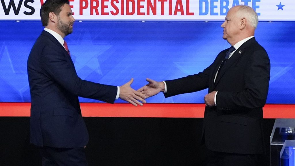 Republican vice presidential nominee Sen. JD Vance, R-Ohio, left, and Democratic vice presidential nominee Minnesota Gov. Tim Walz, shake hands.