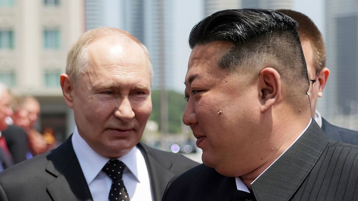 Russian President Vladimir Putin, left, and North Korea