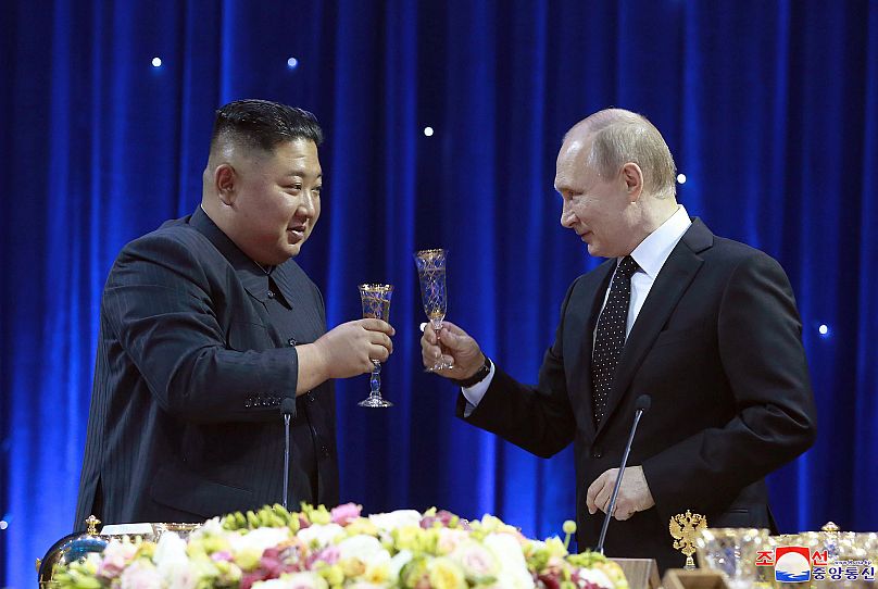 North Korean leader Kim Jong Un, left, toasts with Russian President Vladimir Putin in Vladivostok, 25 April, 2019