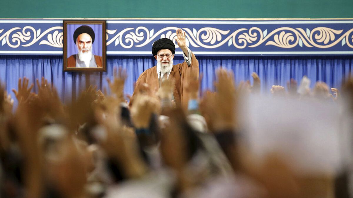 FILE - Supreme Leader Ayatollah Ali Khamenei waves to members of the Revolutionary Guard