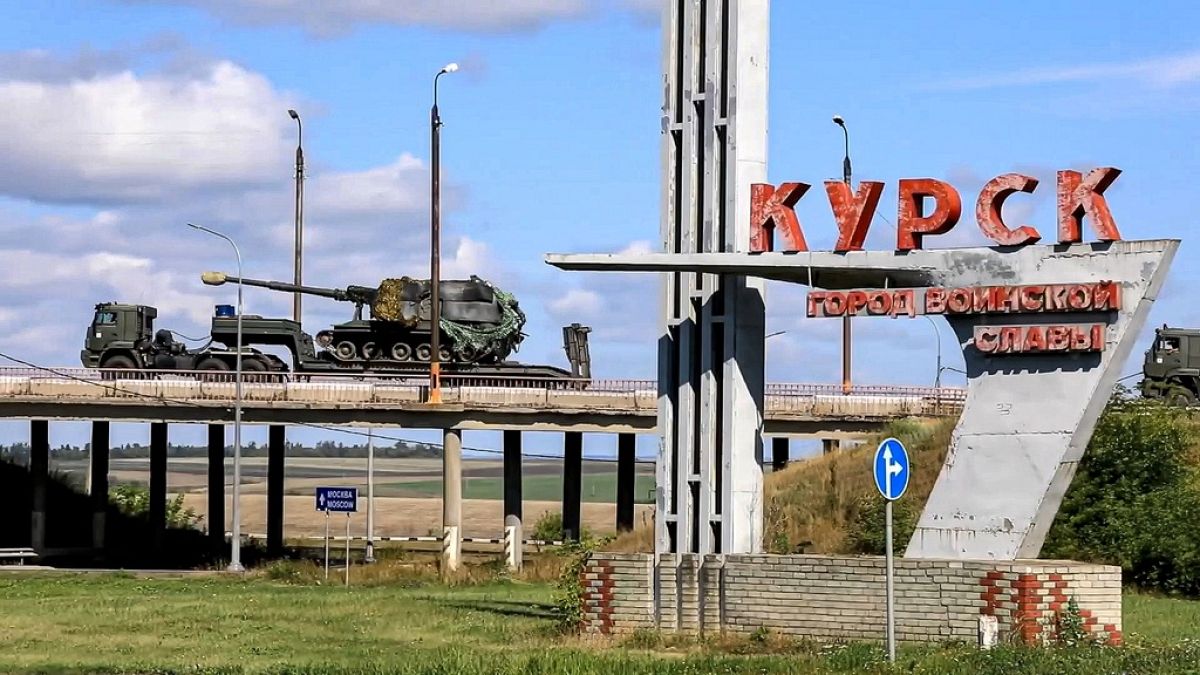 Russian military vehicles move to fight Ukrainian forces in Kursk