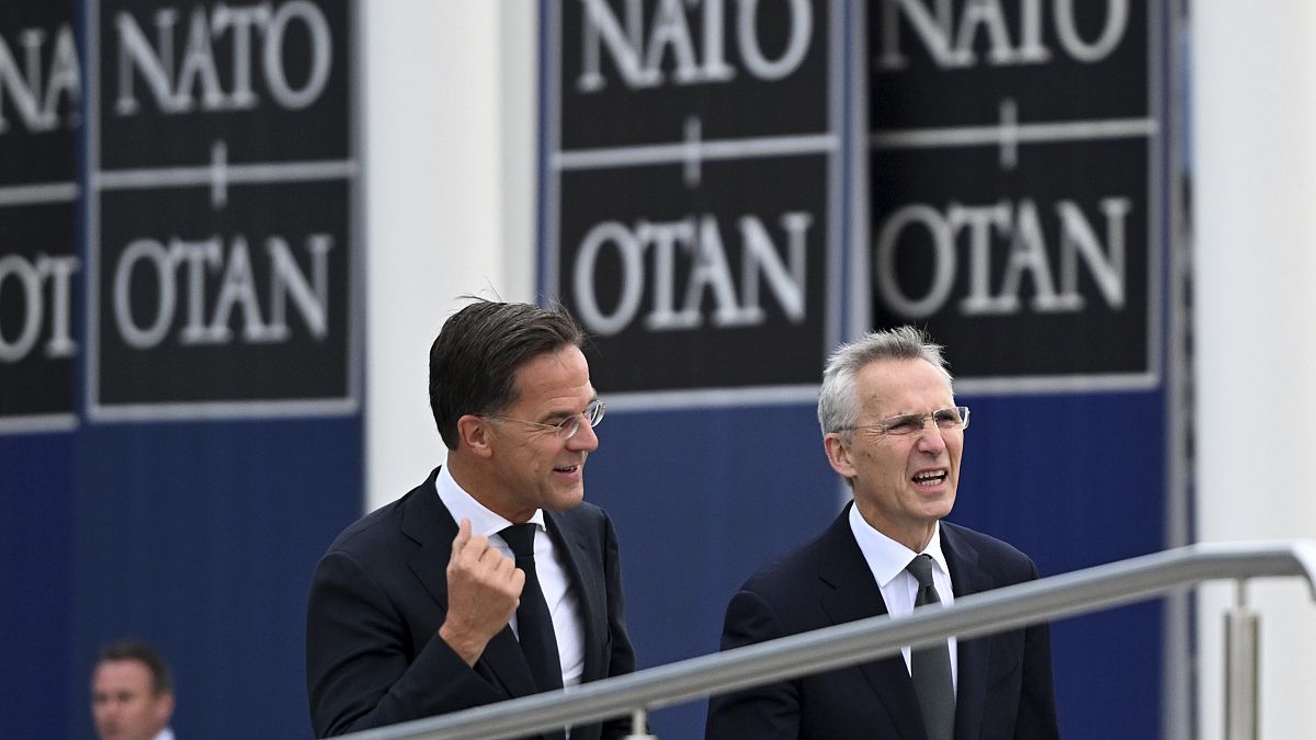 Mark Rutte (left) and Jens Stoltenberg arriving at NATO headquarters on 1 October