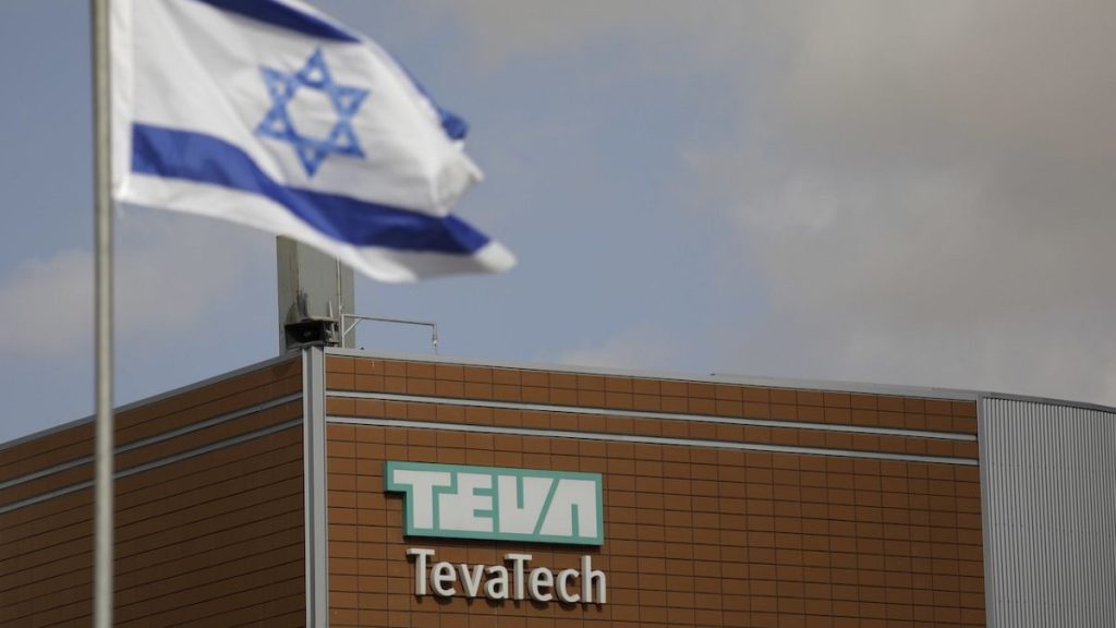 Israeli flag flies outside Teva Pharmaceutical facility building in Neot Hovav, Israel