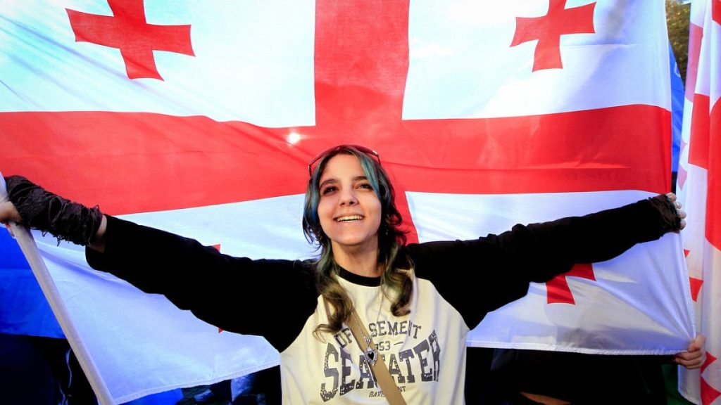 Supporters of the ruling Georgian Dream party attend a rally in the center of Tbilisi, Georgia, Wednesday, Oct. 23, 2024.