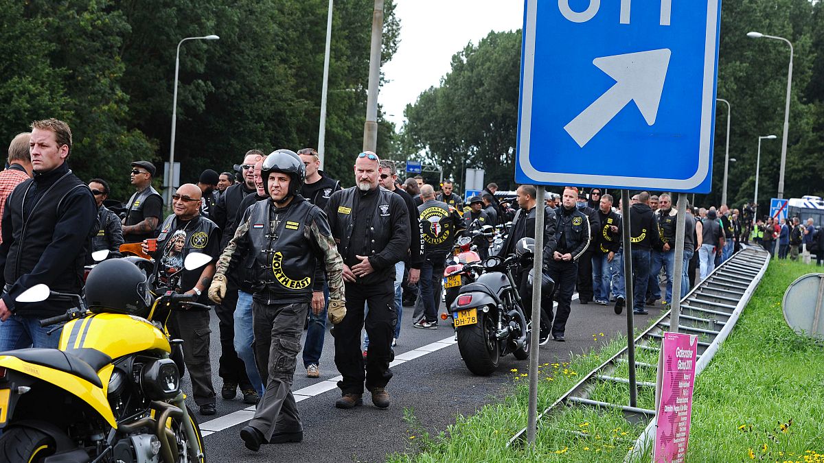 Members of the Satudarah (One Blood) motorcycle gang leave after Dutch riot police blocked a group of 150 riders on the A2 motorway at the entrance to Amsterdam, Netherlands.