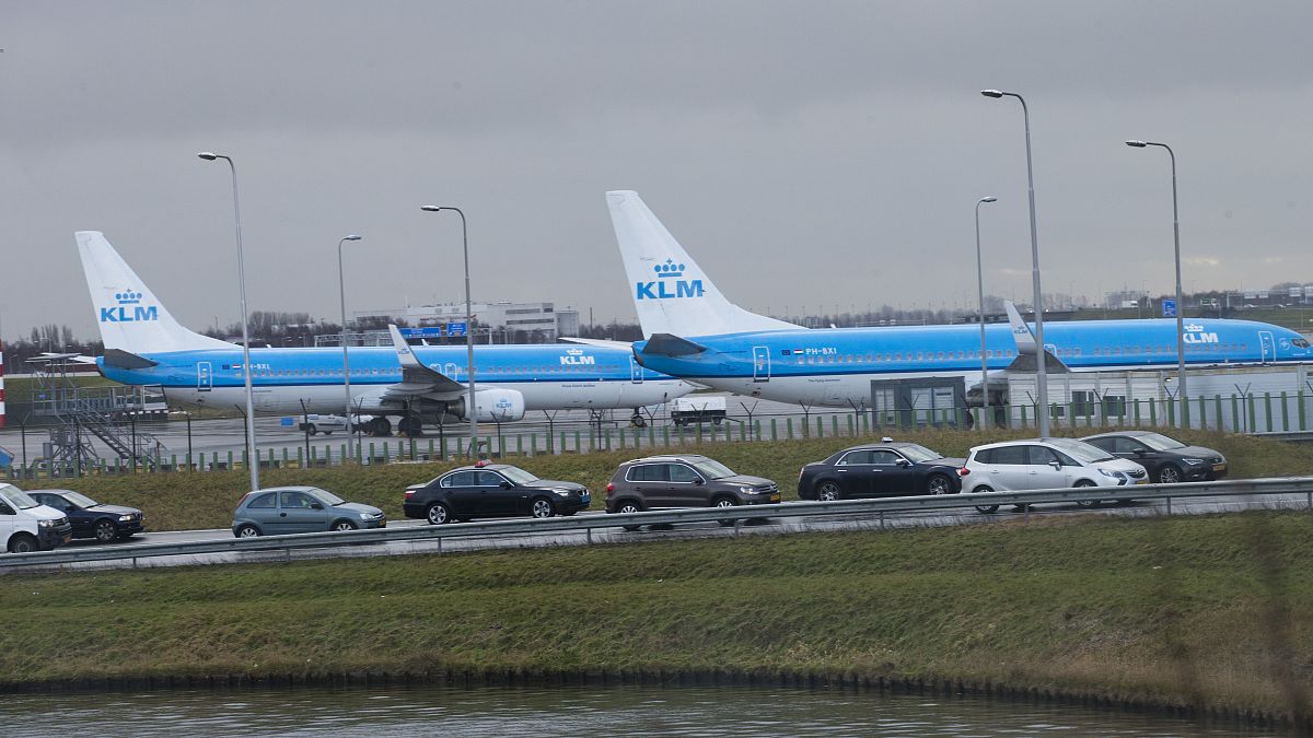 Travellers heading to Schiphol Airport sit in dense traffic near Amsterdam, Netherlands, Thursday, Jan. 18, 2018.