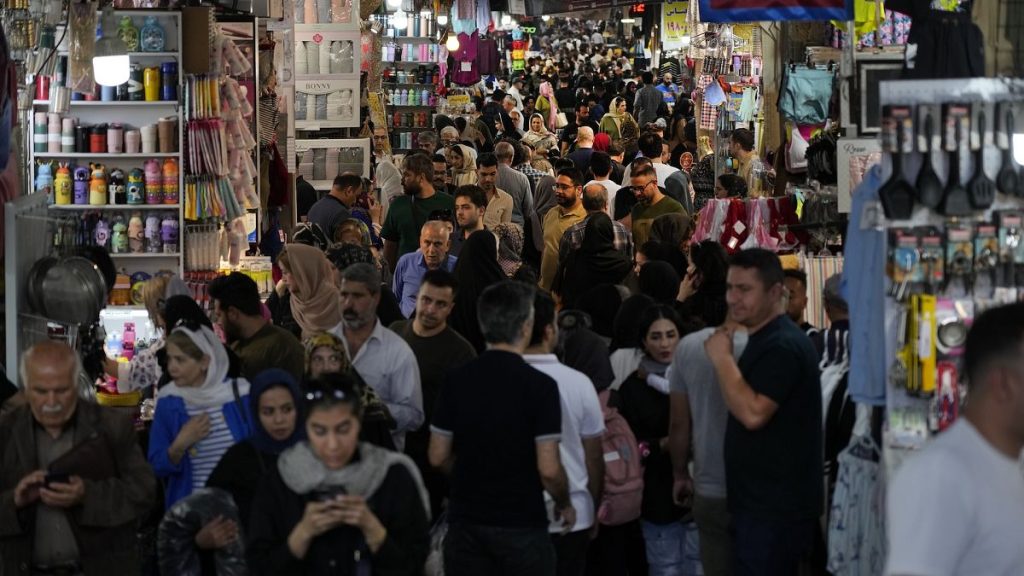 File picture of people walk through the old main bazaar of Tehran, Iran