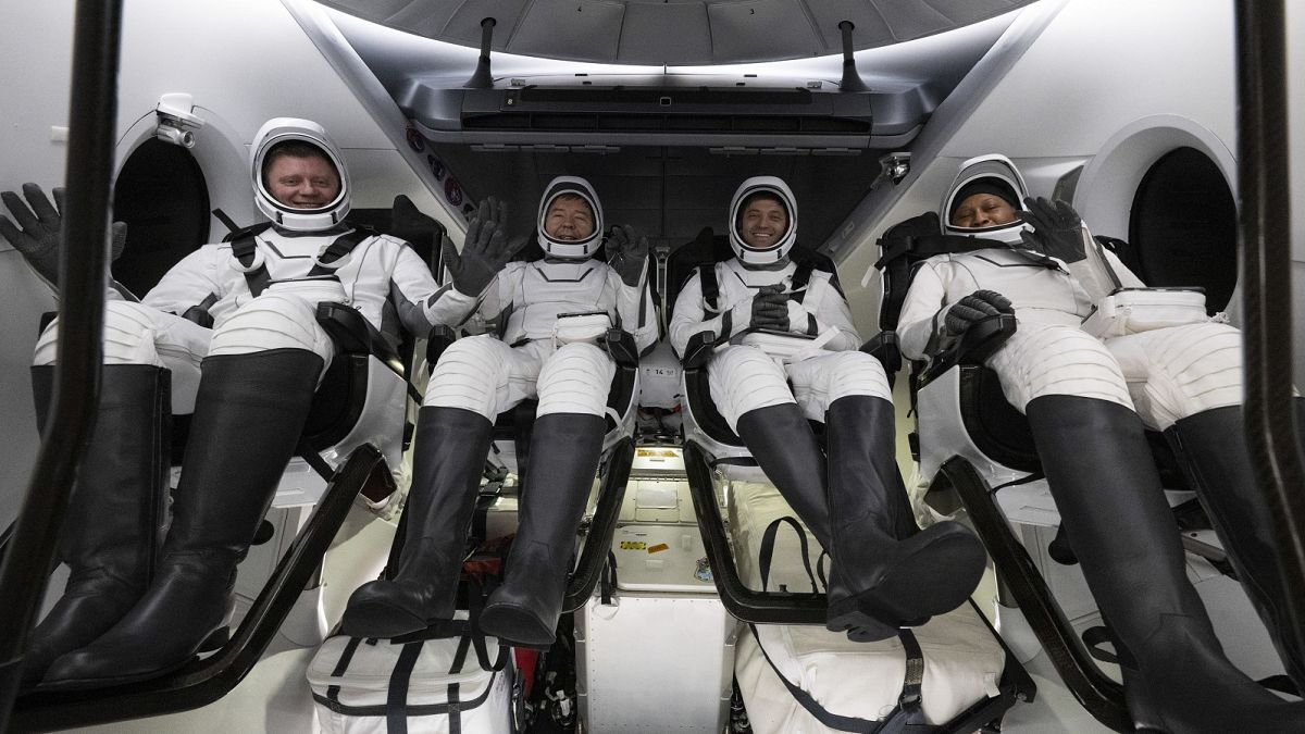 Roscosmos cosmonaut Alexander Grebenkin, left, NASA astronauts Michael Barratt, second from left, Matthew Dominick, second from right, and Jeanette Epps, right.