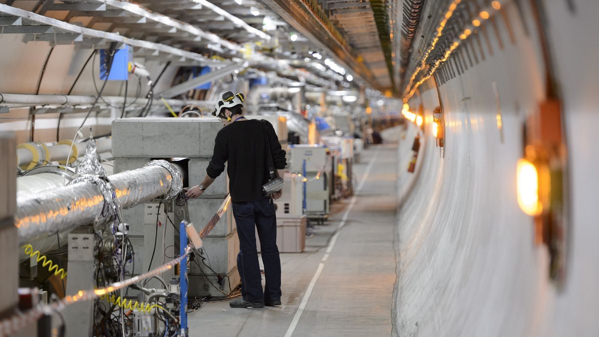 A technician works in the LHC (Large Hadron Collider) tunnel of the European Organization for Nuclear Research, CERN.