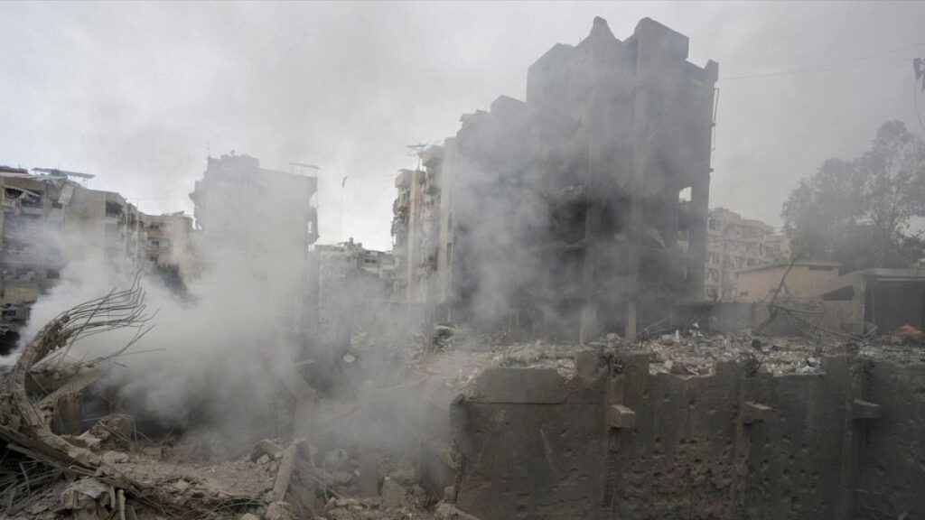 Smoke rises from destroyed buildings at the site of an Israeli airstrike hit in Choueifat, southeast of Beirut, Lebanon, Monday, Oct. 7, 2024.