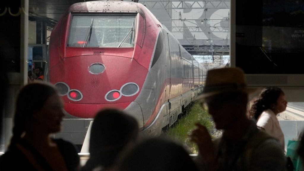 Passengers wait for their trains at Rome