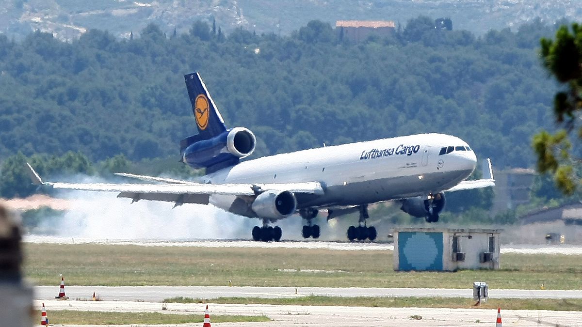 A Lufthansa plane lands to transfer the remains of the victims of the Germanwings aircraft crash to Barcelona in Spain, at Marseille airport, France , Monday, June 15, 2015.