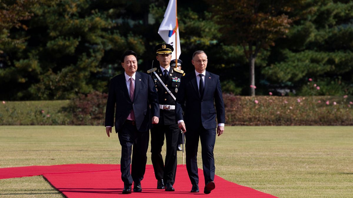 South Korean President Yoon Suk Yeol, left, and Poland