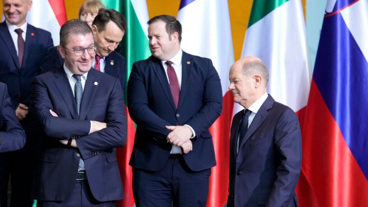 Prime Minister of Croatia Andrej Plenkovic watches German chancellor Olaf Scholz arriving for a family photo during the