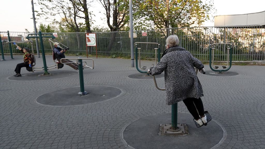 Elderly people exercise in a park in Serbia in 2020.