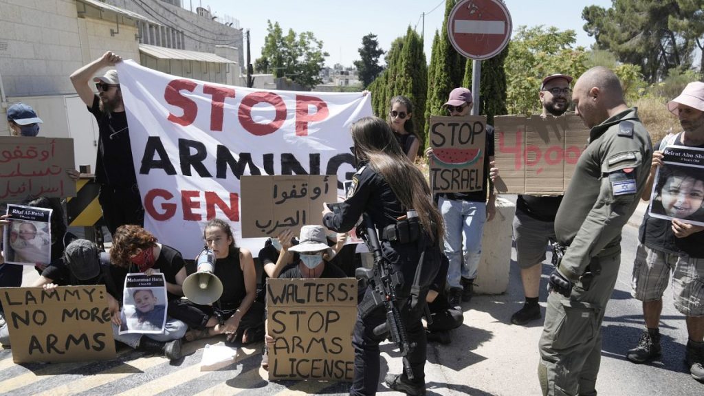 Police clear protesters, some chained, outside of the British consulate in east Jerusalem, to call on the U.K. to stop providing arms to Israel for its war in the Gaza Strip