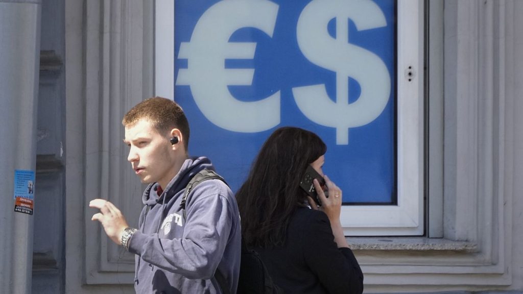 People walking past a currency exchange office