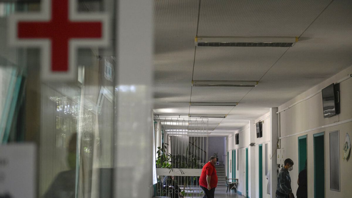 People walk in a corridor at the state hospital in Bulgaria in 2021.