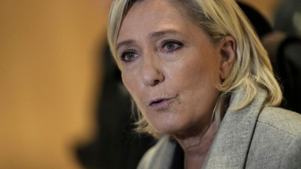 French far-right leader Marine Le Pen speaks to the media as she arrives at the court house in Paris, Monday, Sept. 30, 2024.